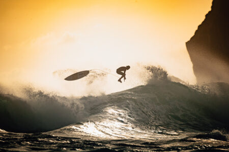 Surfer jumping over the wave in Sumbawa by Markush photography